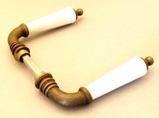 Deurklinken (paar) brons antiek met wit porselein.