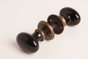 Deurknop (paar) zwart porselein brons antiek 61mm met rozetten