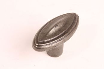 Ovale knop in tinkleur 65mm met randje. Ovale knop gemaakt van gietijzer met een kleurafwerking van tinkleur/blank ijzer.